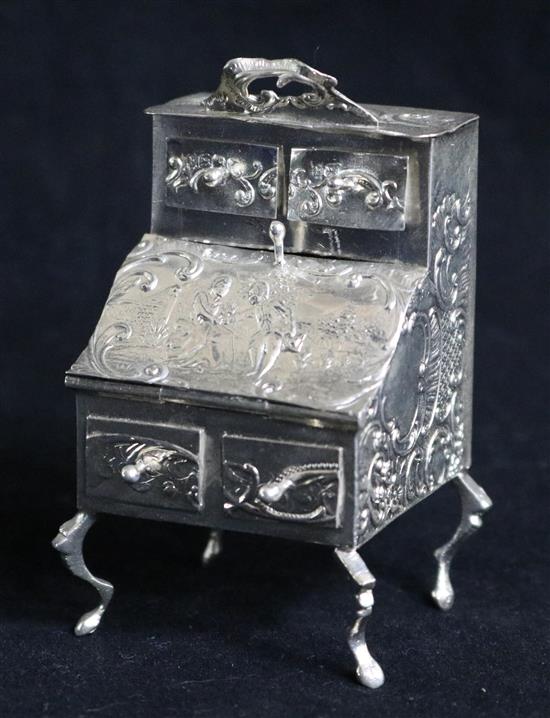 A late 19th century German Hanau? miniature silver model of a bureau cabinet, import marks for William Moering, London, 1895, 78mm.